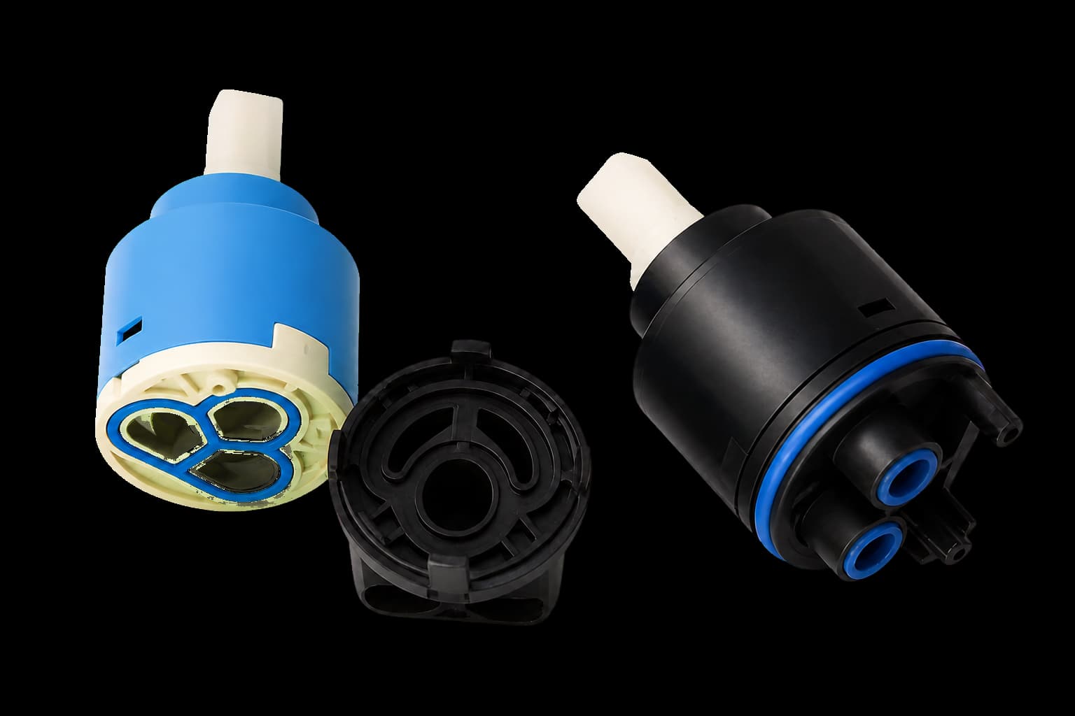 Molded valve spools, cartridges and internal flow-control parts used to explain material selection.